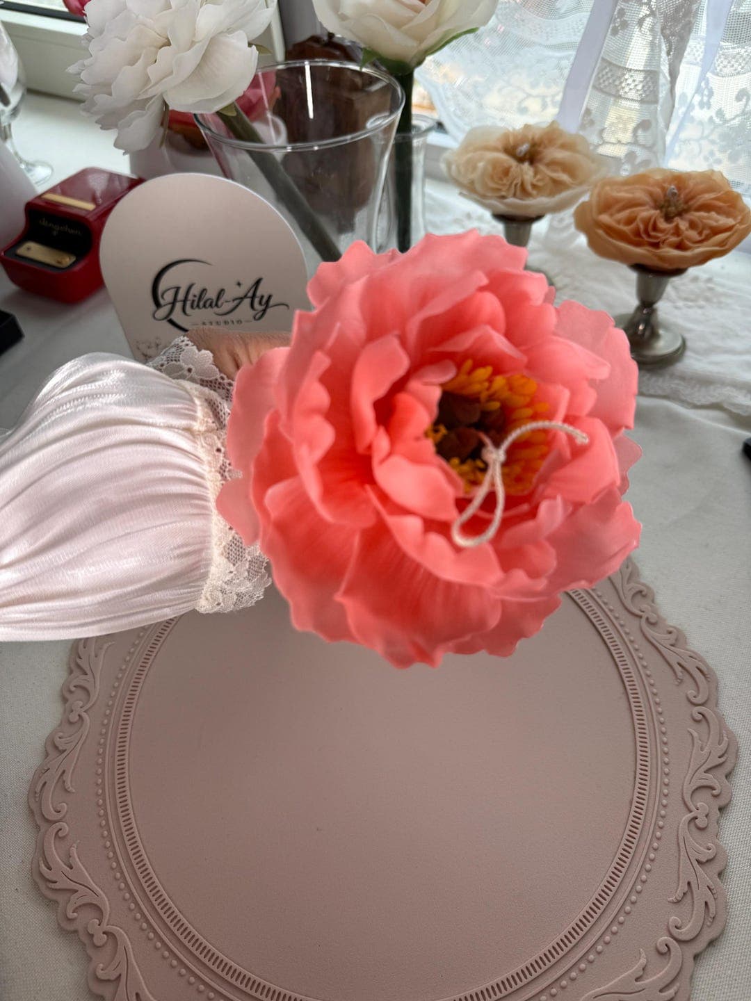 Close view of the layered beeswax petals of the large peony candle